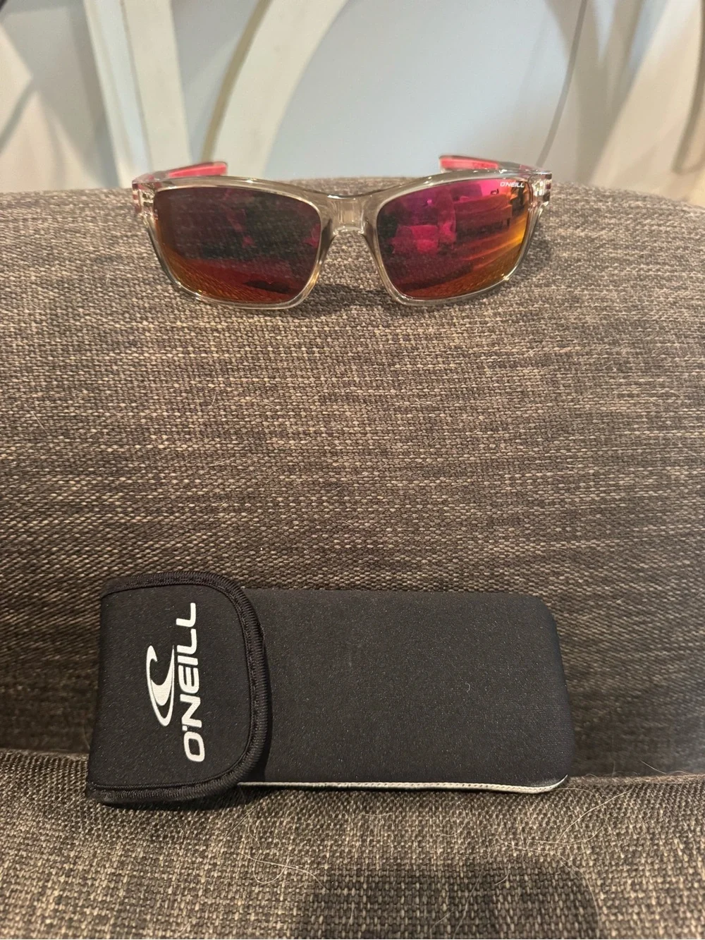 O'Neill Men's Clear Frame Sunglasses with Pink-Orange Mirrored Lenses